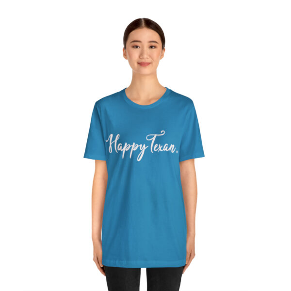 A woman wearing a blue t-shirt with the words happy face written on it.