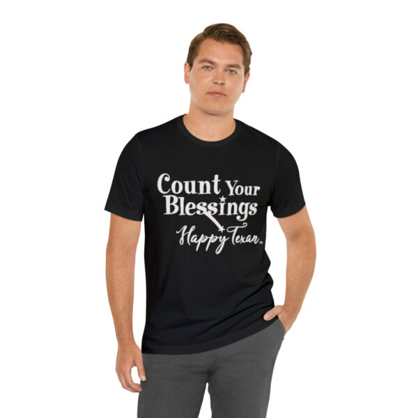 A man wearing a black t-shirt with the words " count your blessings happy hour ".