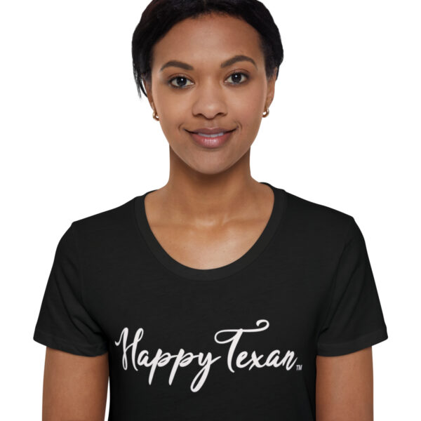 A woman wearing a black t-shirt with the words " happy texas ".