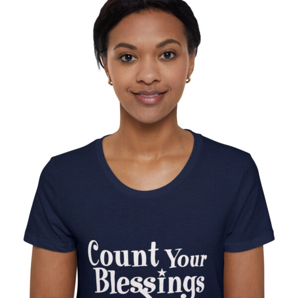 A woman wearing a t-shirt with the words " count your blessings ".