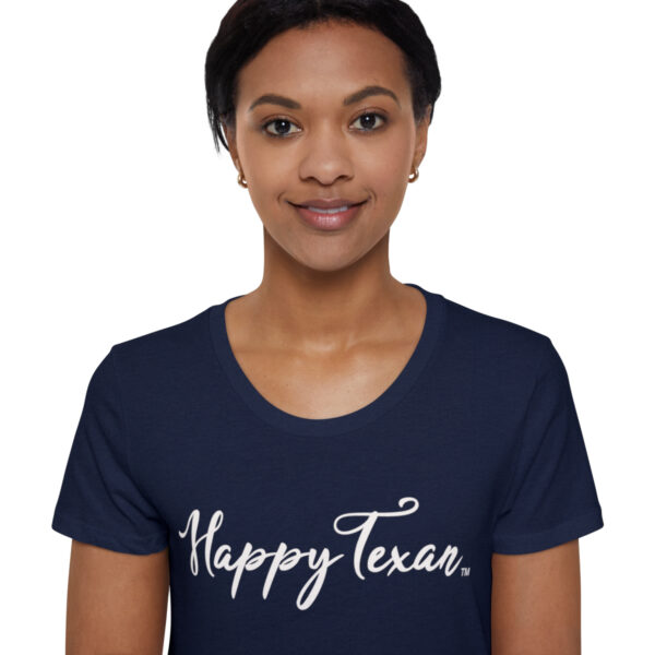 A woman wearing a t-shirt with the words " happy texas ".