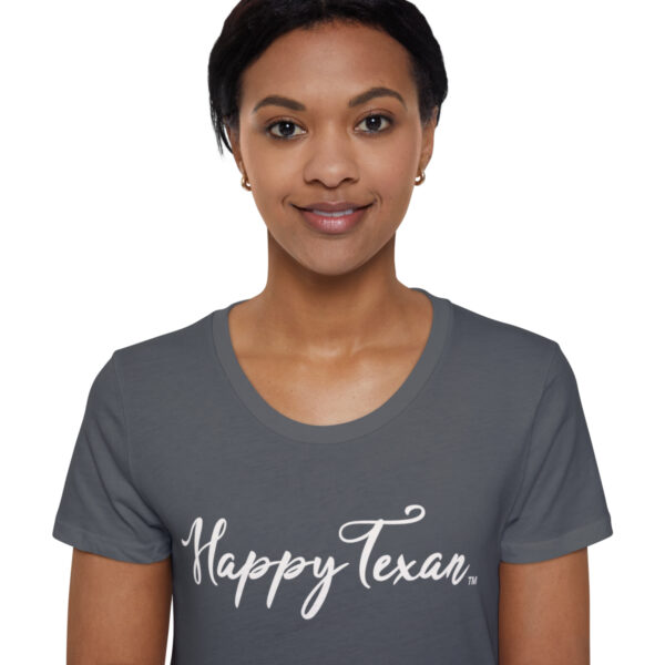 A woman wearing a t-shirt with the words " happy texas ".