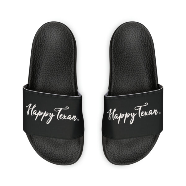 A pair of black slides with the words " happy texas ".