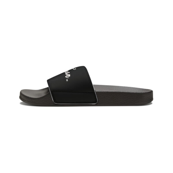 A pair of black slides on top of a white background.