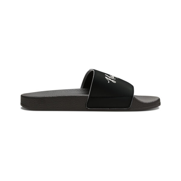 A pair of black slides on top of a white background.