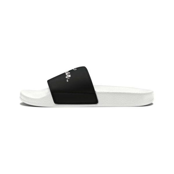 A pair of white and black slides on top of a white background.