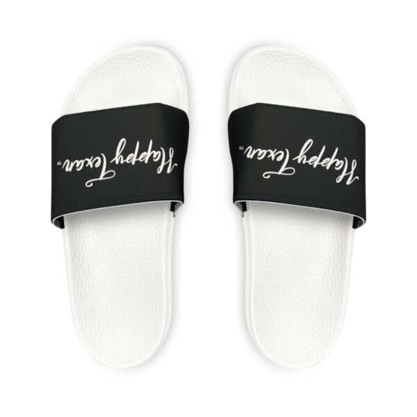 A pair of white and black sandals with the words " happy friday buddy ".