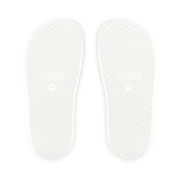 A pair of white sandals with the soles off.