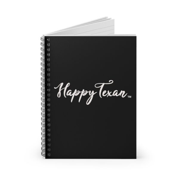 A spiral notebook with the words " happy texas ".