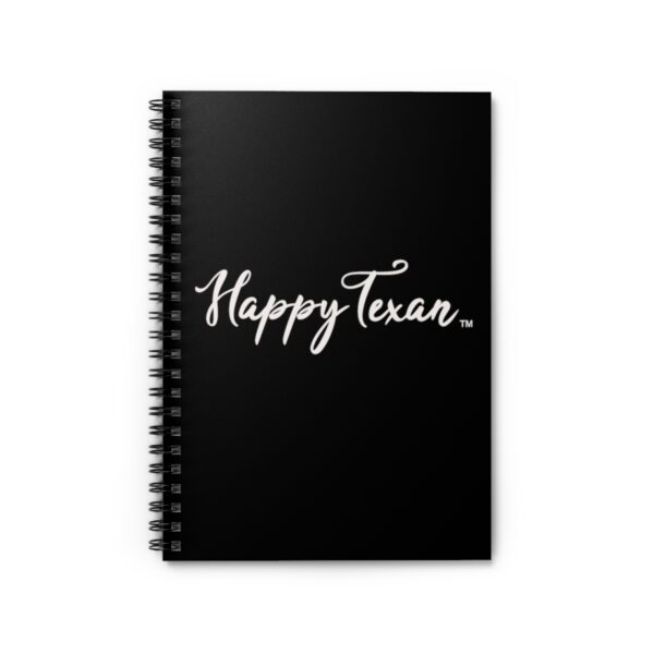 A black spiral notebook with the words " happy texan ".