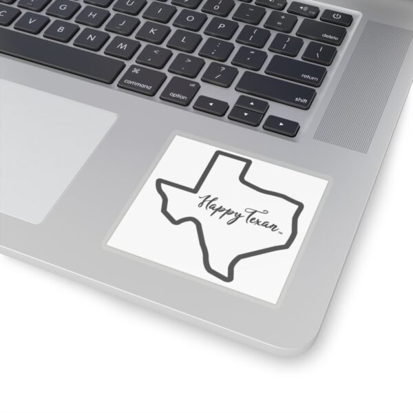 A laptop with a sticker of the state of texas.