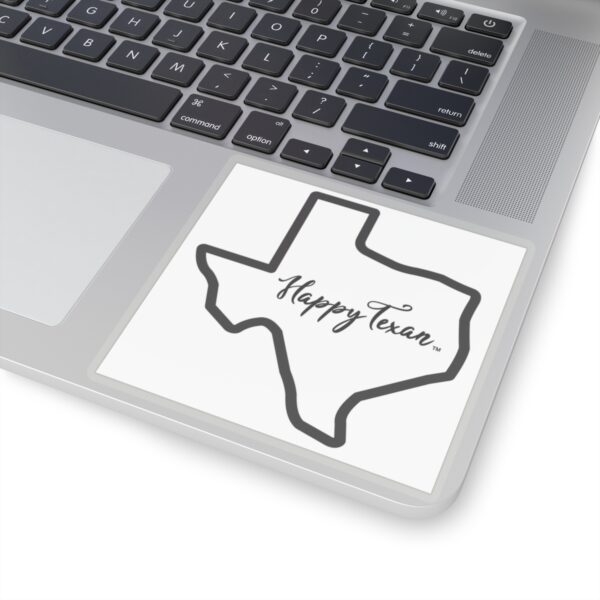 A laptop with a sticker of the state of texas.