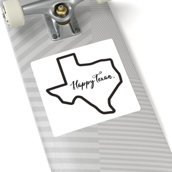 A sticker of the state of texas with the words " happy texas ".