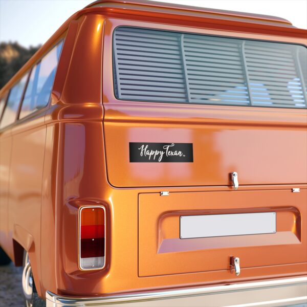 A close up of the back end of an orange van.