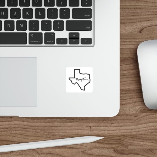 A laptop and mouse on top of a wooden desk.