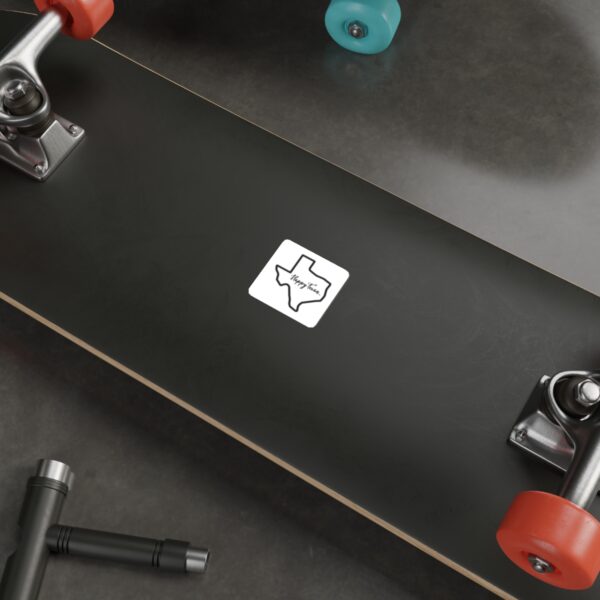 A skateboard with a sticker on it and some other things