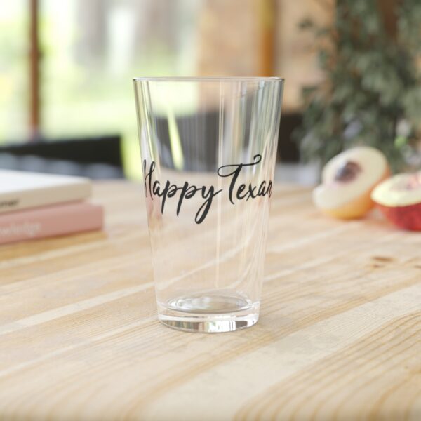 A glass with the words happy texas written on it.