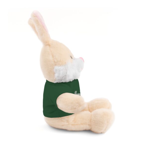 A stuffed bunny rabbit sitting down with its head up.