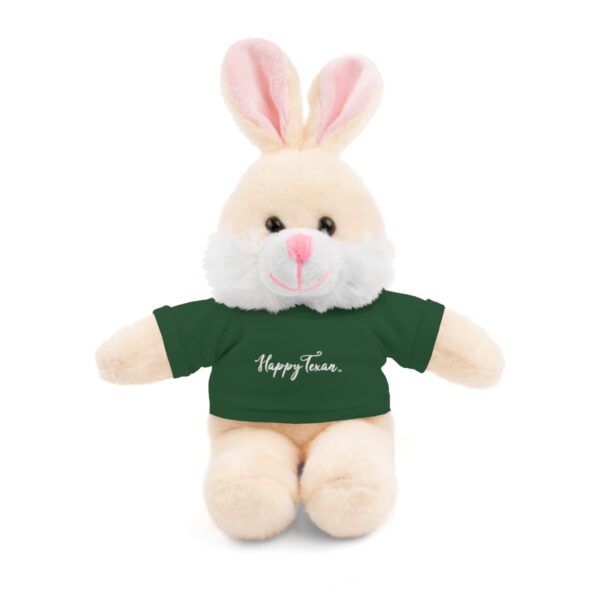 A stuffed bunny with a green shirt on it's head.