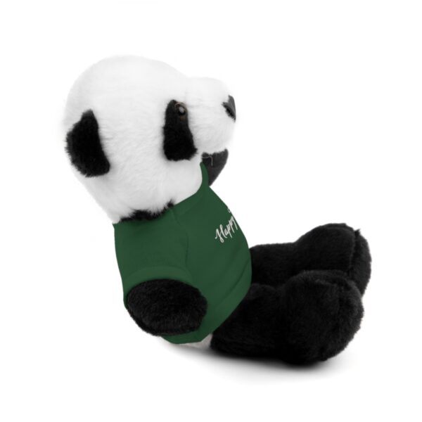 A stuffed panda bear sitting down with its head on the ground.