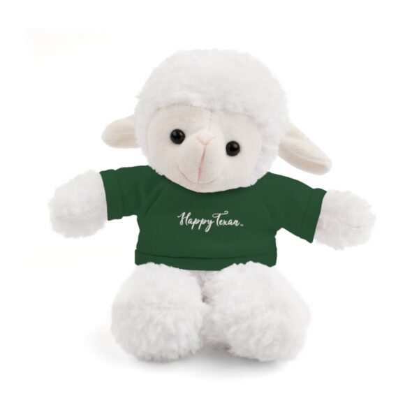 A stuffed lamb with a green shirt on it's back.