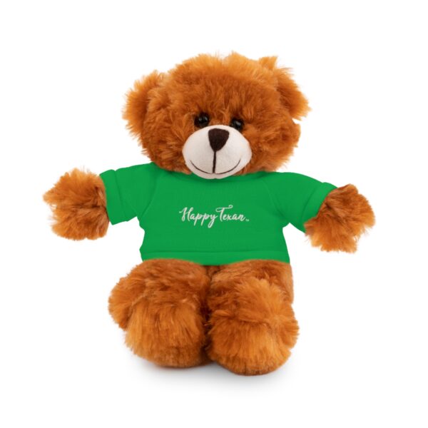 A brown teddy bear wearing a green shirt.