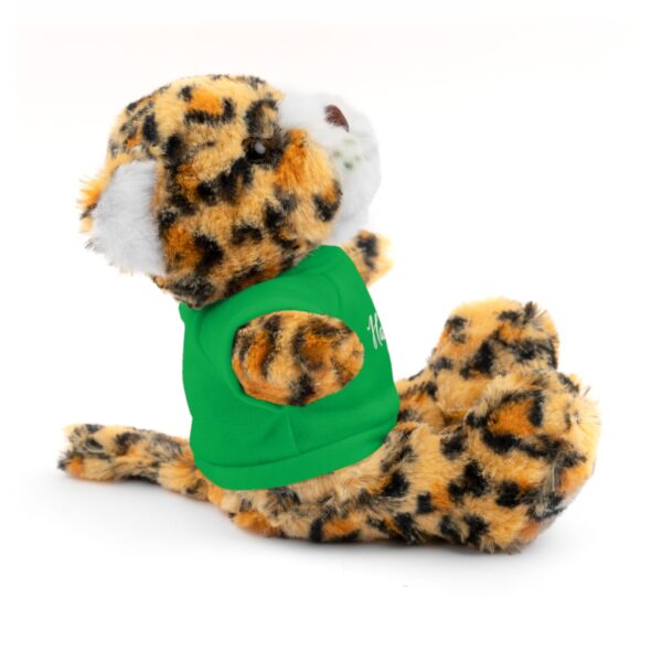 A stuffed animal with a green bib on it's back.