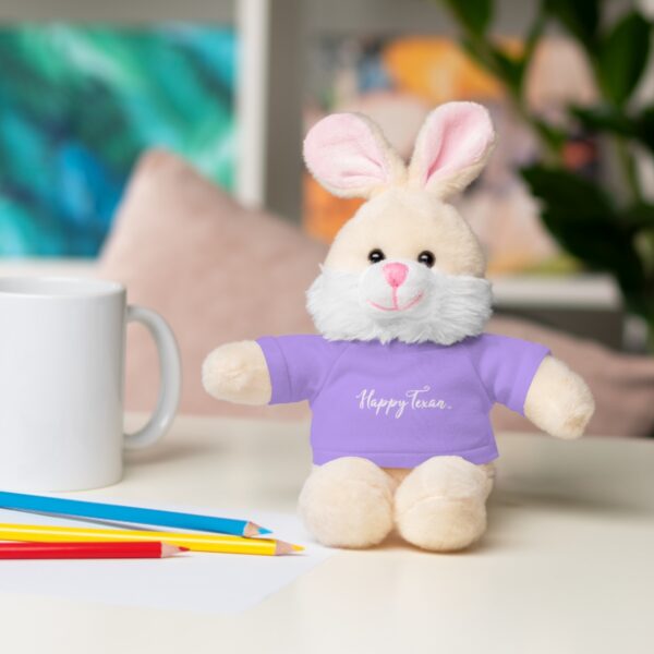 A stuffed bunny sitting on top of a table.