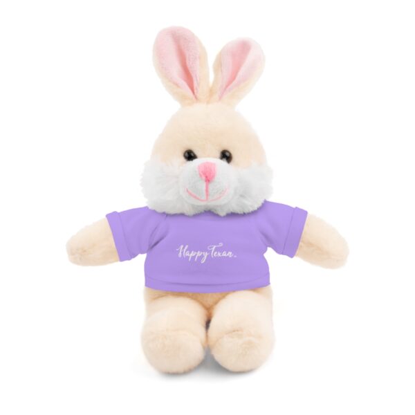 A stuffed bunny with a purple shirt on it's chest.