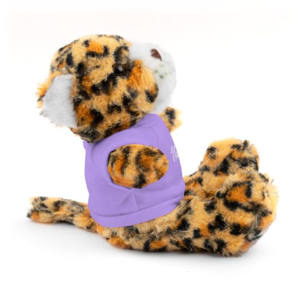 A stuffed animal with a purple shirt on it