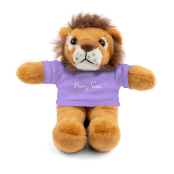 A stuffed lion with a purple shirt on