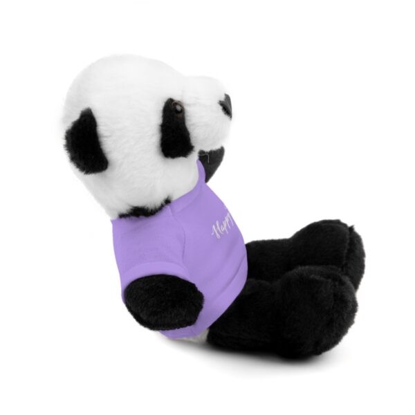 A stuffed panda bear with a purple shirt.