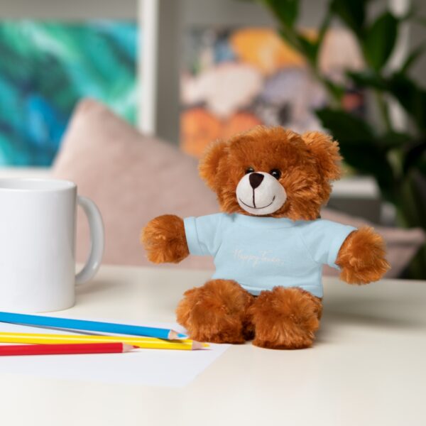 A brown teddy bear sitting on top of a table.