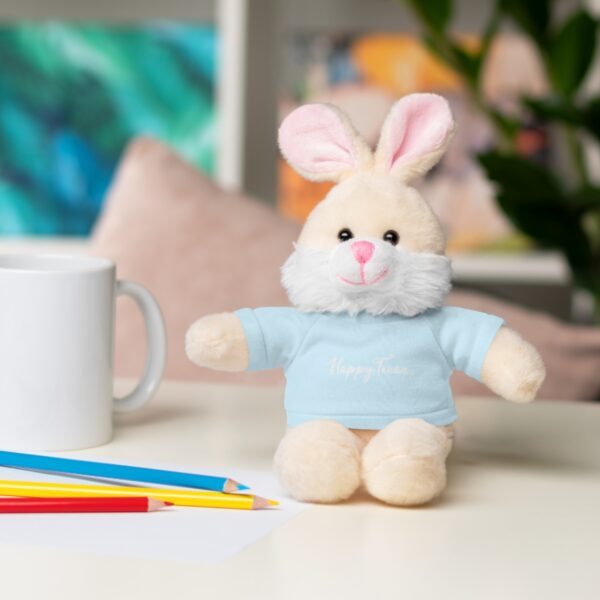 A stuffed bunny rabbit sitting on top of a table.