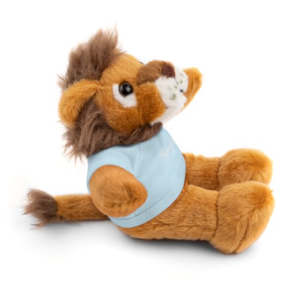 A stuffed lion with a blue shirt on it's back.