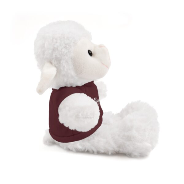 A stuffed animal is sitting down and has no eyes.