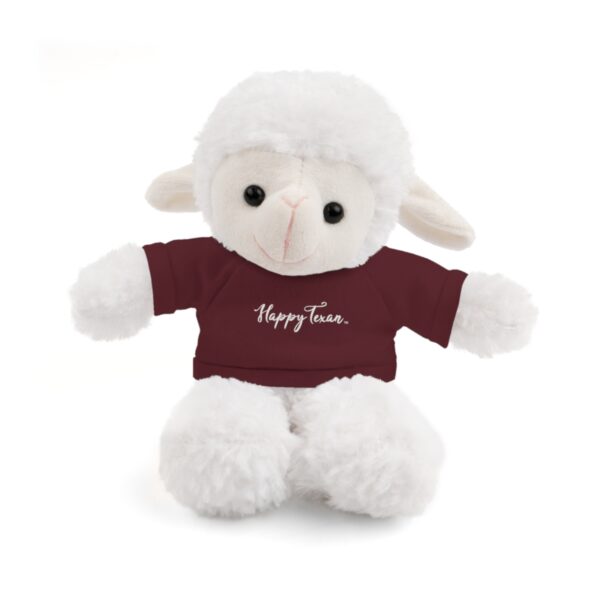 A stuffed lamb with a t-shirt on it's back.