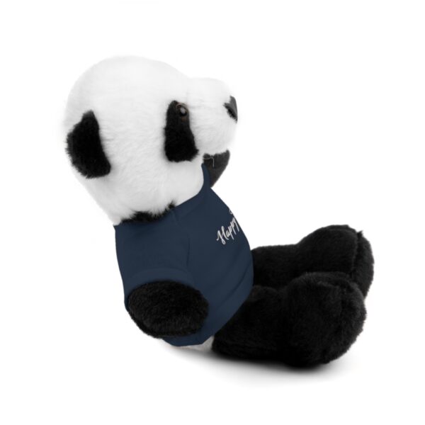 A stuffed panda bear wearing a blue shirt.