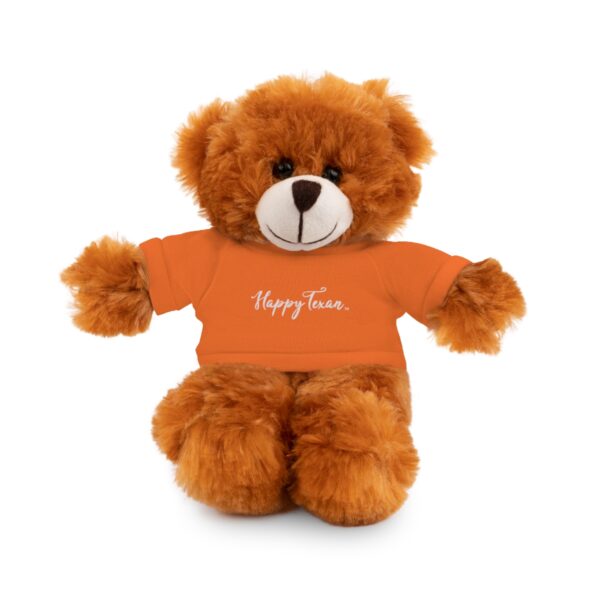 A teddy bear wearing an orange shirt with the words happy fun.