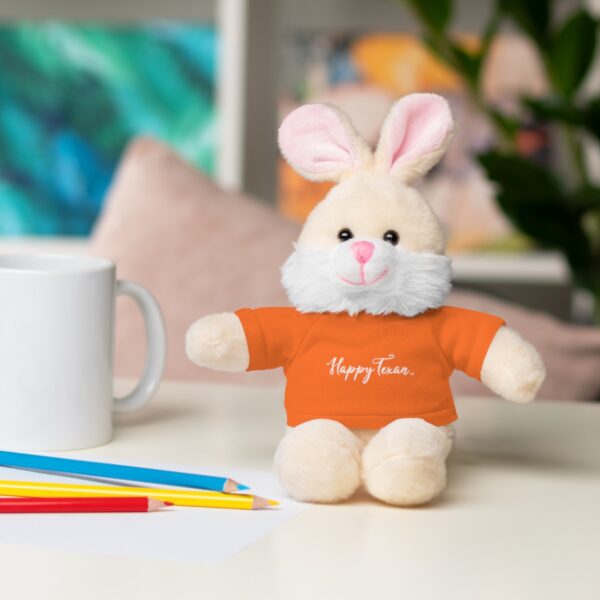 A stuffed bunny rabbit sitting on top of a table.