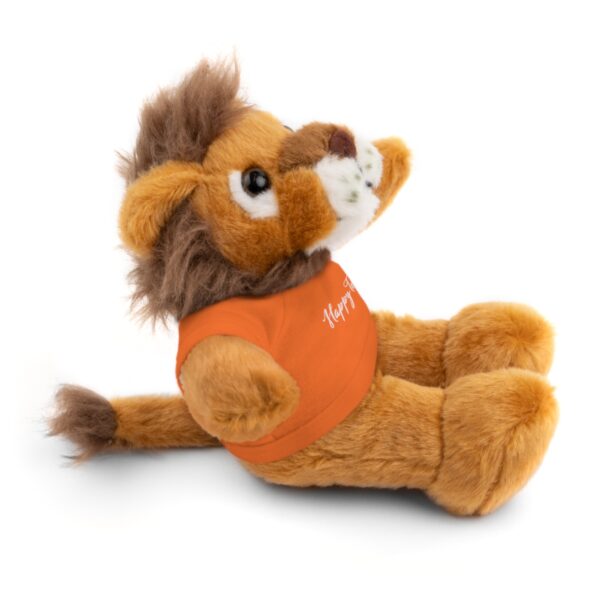 A stuffed lion with an orange shirt on.