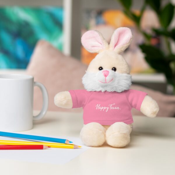 A stuffed bunny rabbit sitting on top of a table.