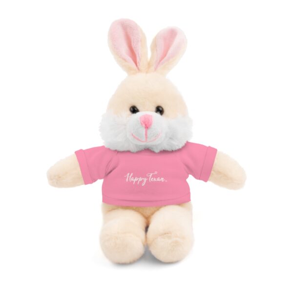 A stuffed bunny with a pink shirt on it's chest.