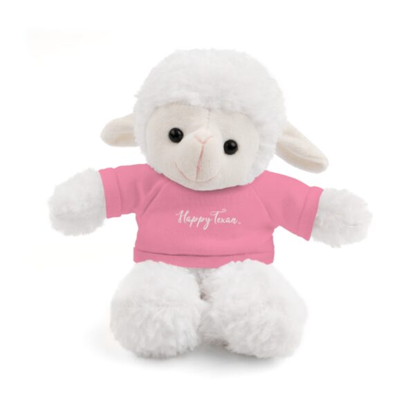 A white stuffed lamb with pink shirt and name on it.