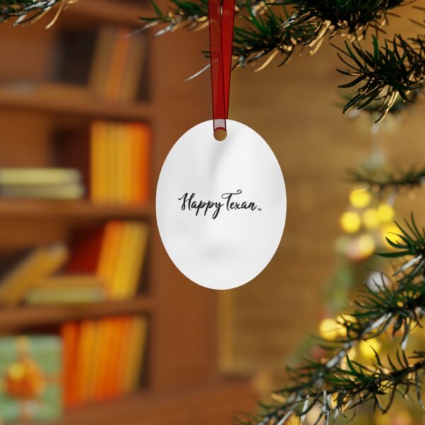 A white ornament hanging from the side of a tree.