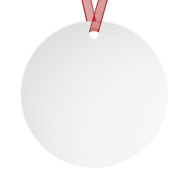 A round white ornament with a red ribbon.