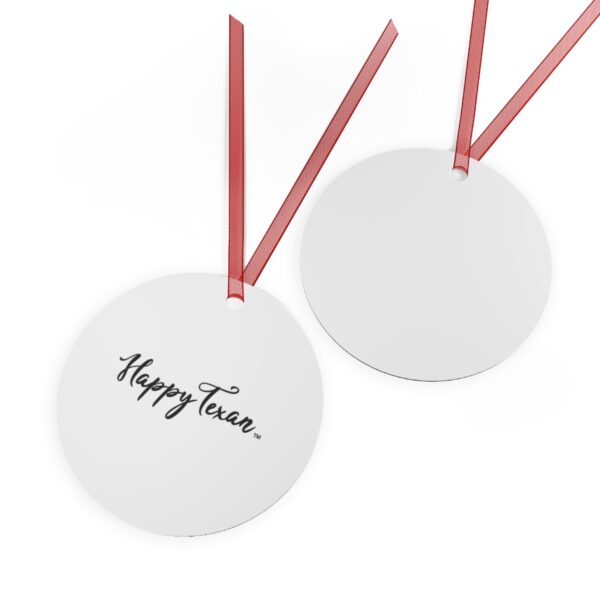 A pair of round tags with red ribbon hanging from the back.