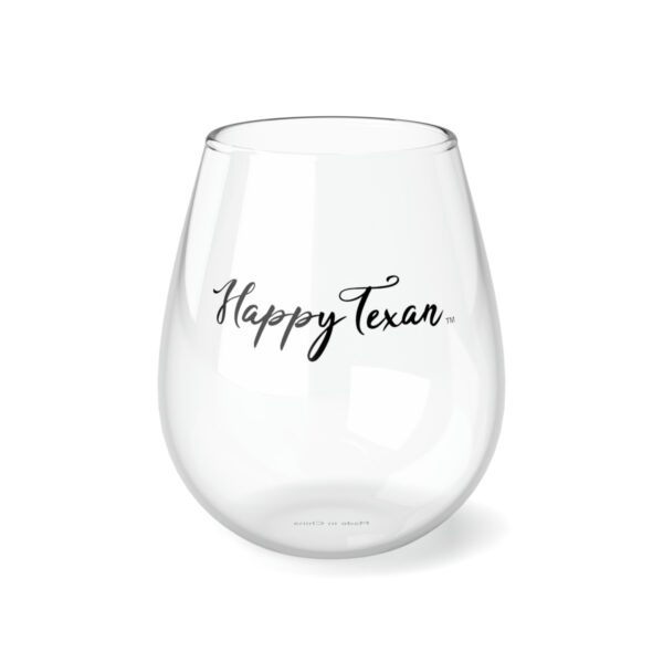 A glass with the words " happy texas ".