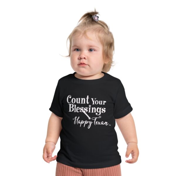 A toddler wearing a Bella+Canvas 3001B Baby Short Sleeve T-Shirt - Count Your Blessings happy tee.